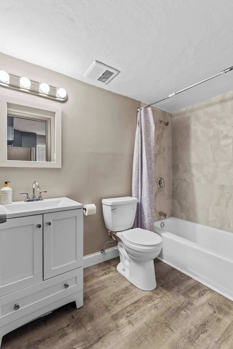 Bathroom — tub/shower combo and vanity