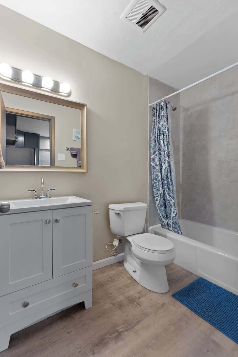 Bathroom — tub/shower combo and vanity