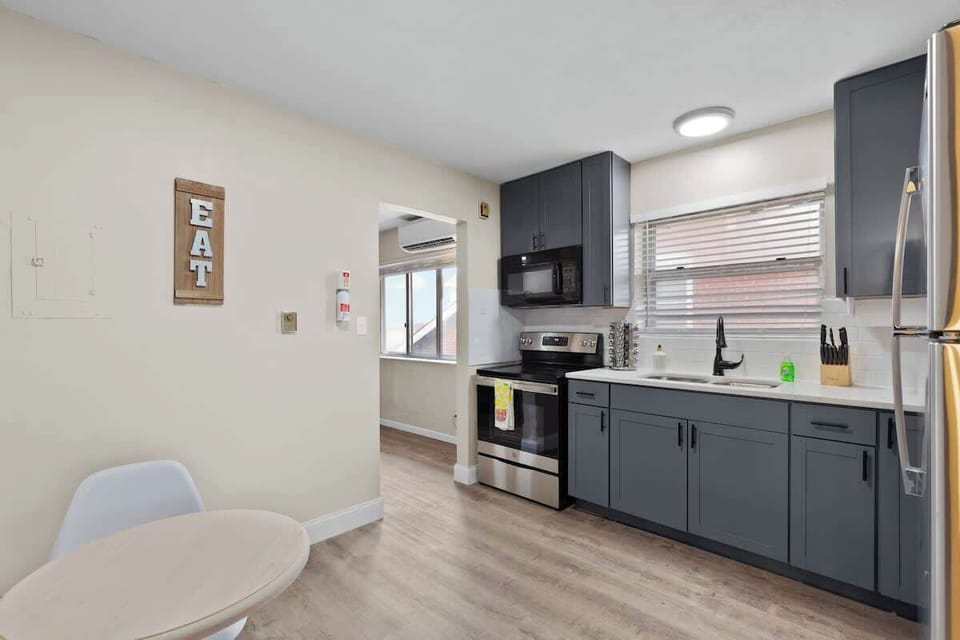 Full kitchen — stove, microwave, and everything to cook with
