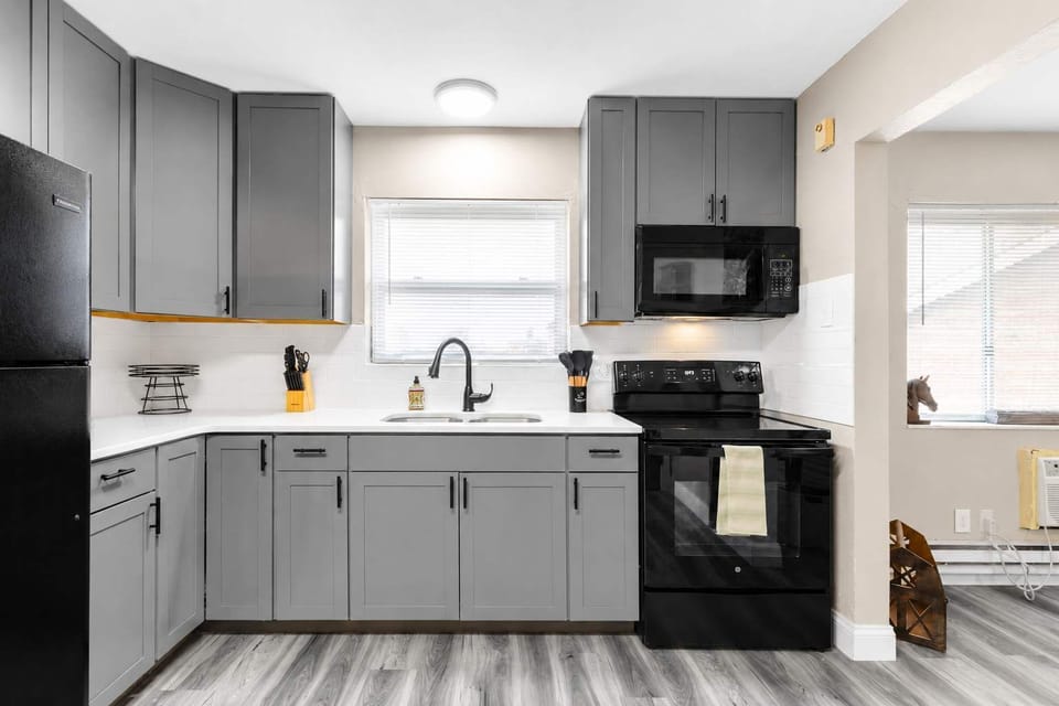 Full private kitchen — dishwasher, big sink, and dining for two