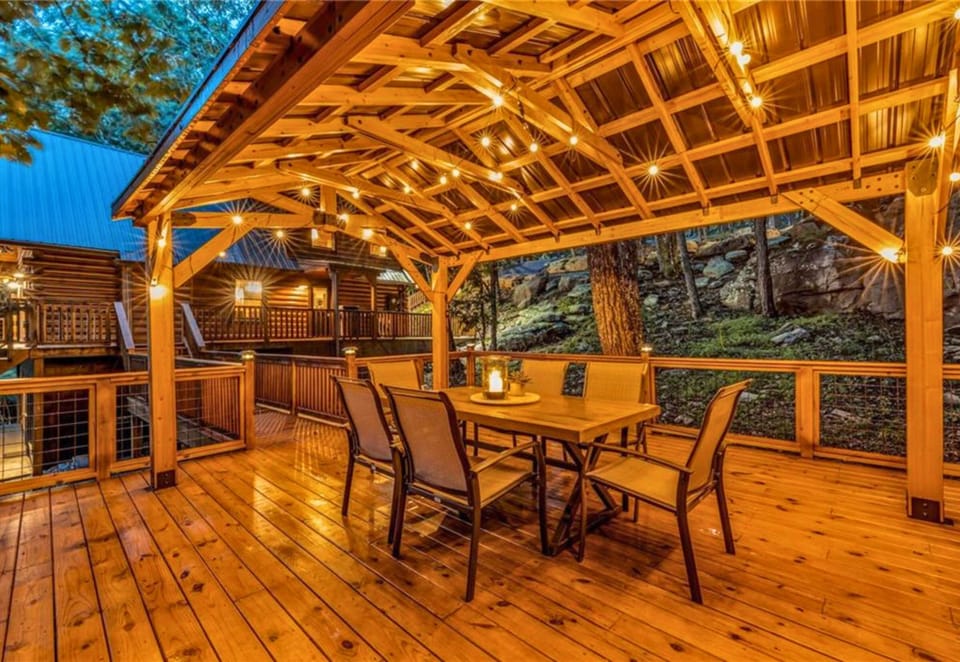 Dinner with a view. Our covered pavilion deck is strung with lights and set for 
