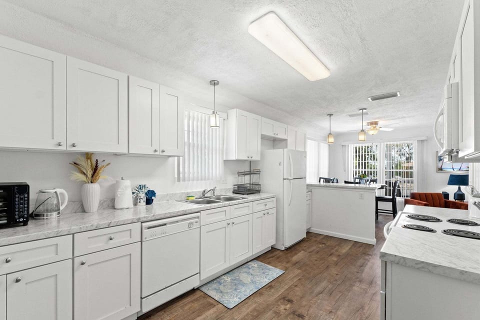 The kitchen offers plenty of space to create gourmet meals with room to prep, cook, and gather.