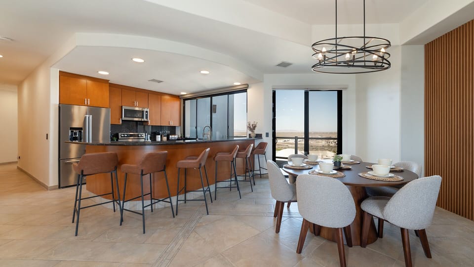 Seating at the kitchen counter, and dining table.