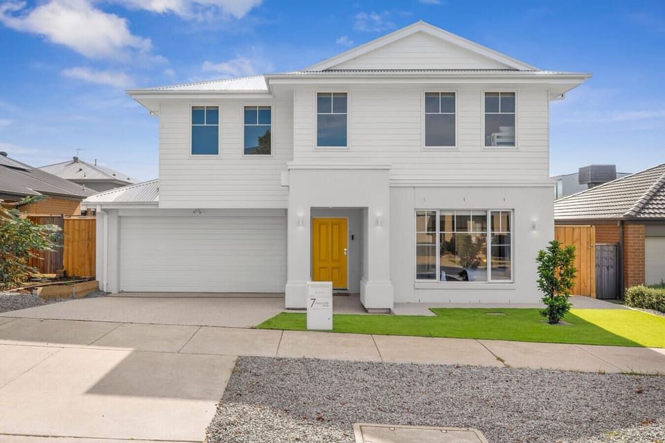 Modern coastal home with a welcoming facade, double garage, and fresh contemporary design.