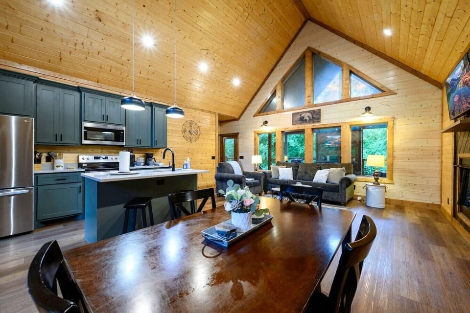 The wide-open layout keeps families connected from breakfast at the table to evenings by the fire.