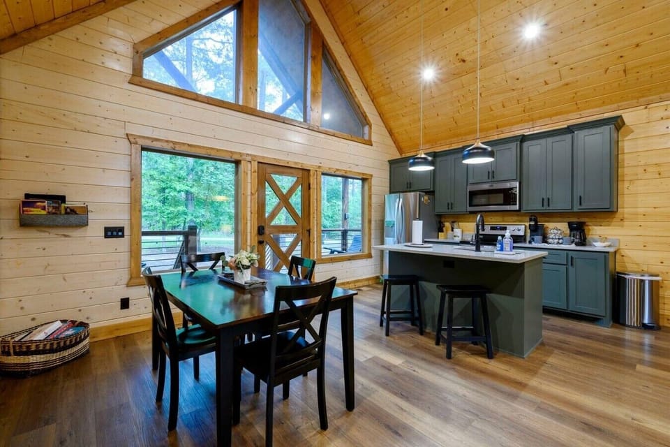 Natural light pours through big windows as families cook together in this stunning open kitchen.