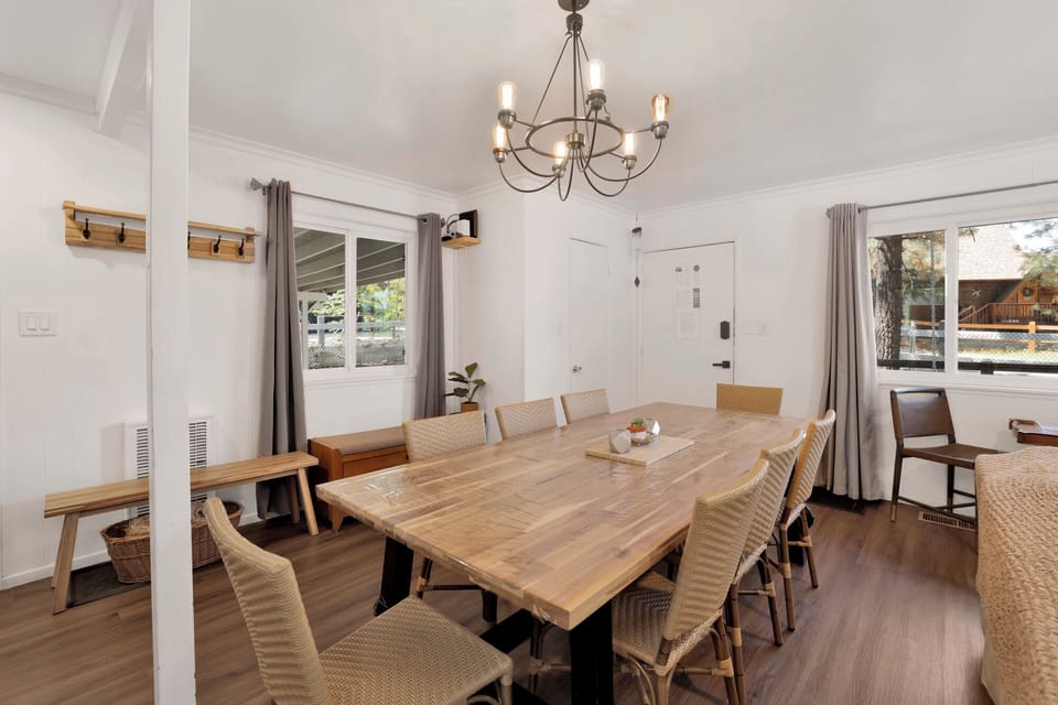 Gather around the dining table which seats the whole group comfortably perfect for big meals and good company.