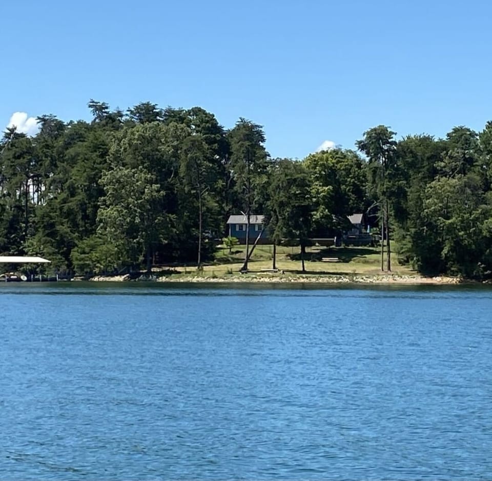 Front of property from lake. Dock on the left side