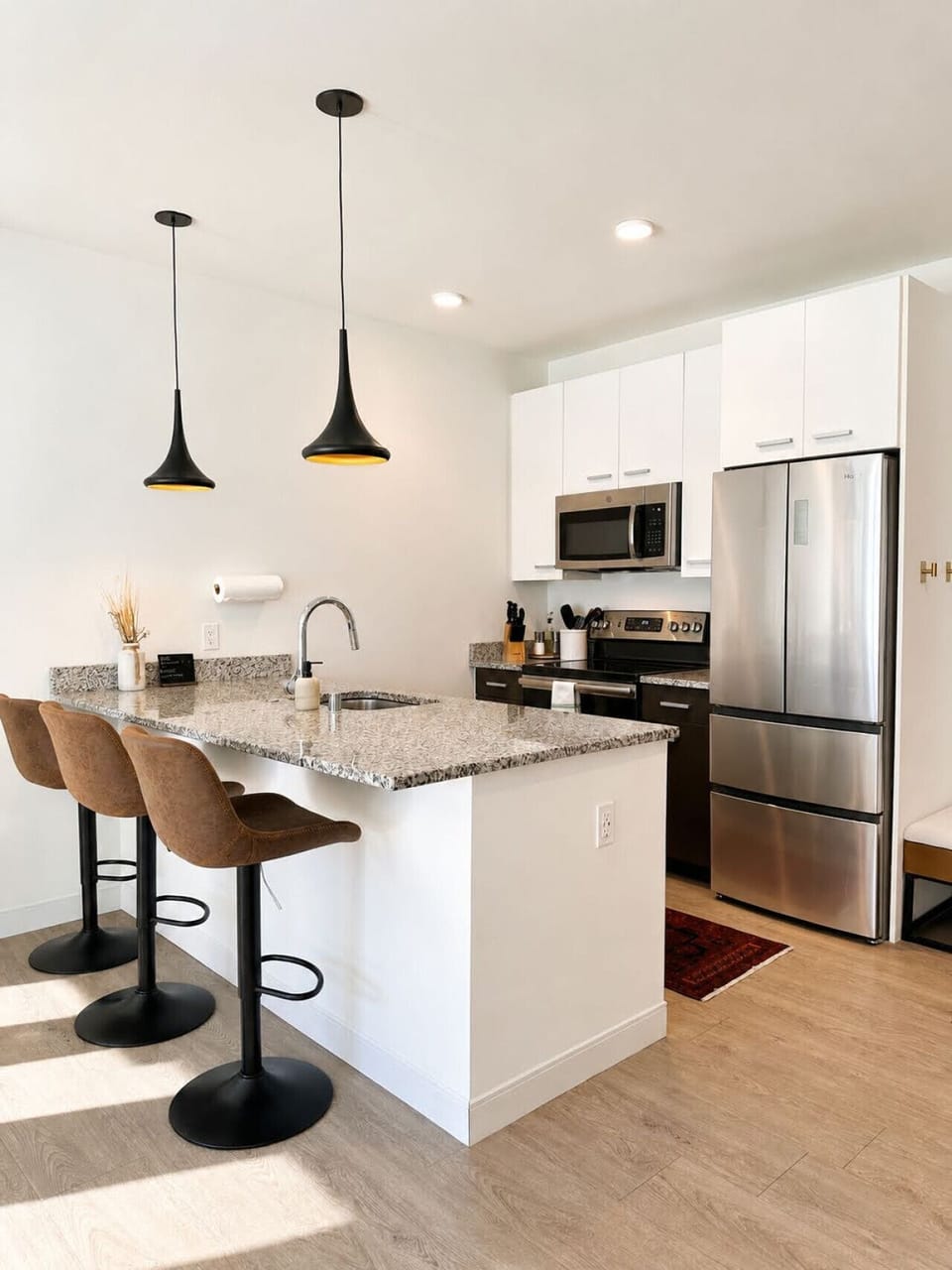 A fully-equipped kitchen with bar stool seating—everything you need to prep, cook, and refuel