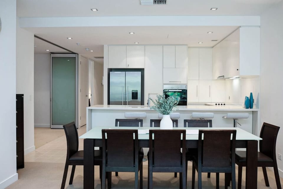 Gather around the large dining table for long meals and conversation, with the open-plan layout keeping everyone connected.