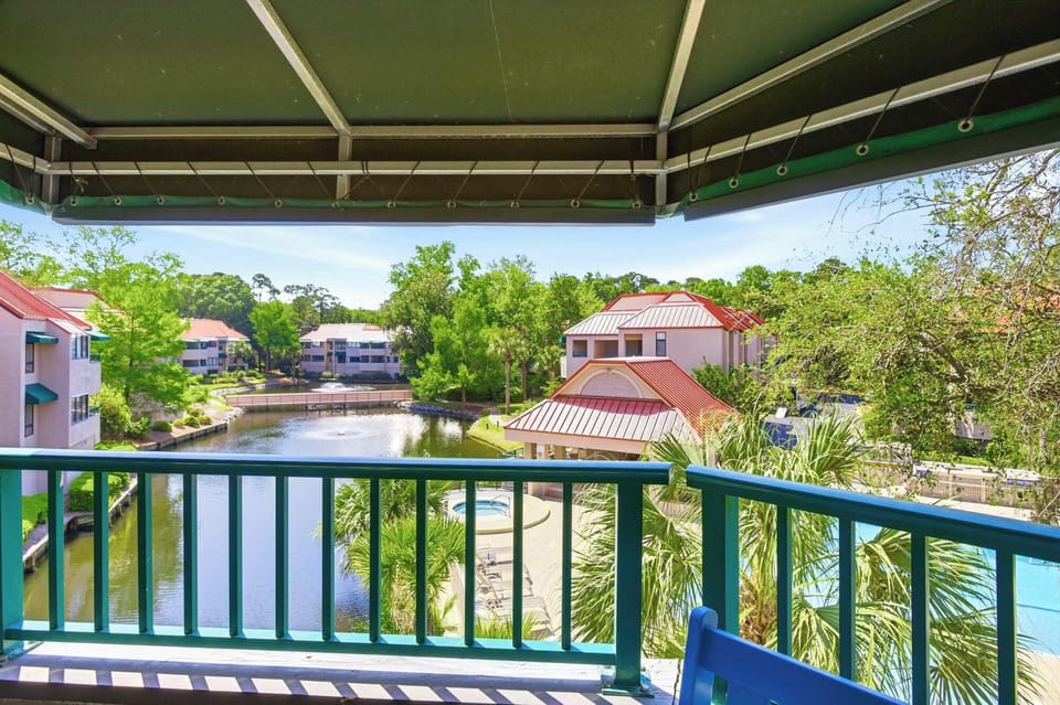 Wake up to lagoon views, fountain sounds, and lush Lowcountry greenery from your private balcony - a soundtrack of birdsong included.