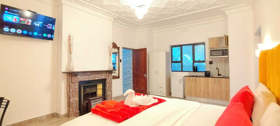 Luxury Apartment, Garden View | In-room safe, desk, laptop workspace, iron/ironing board