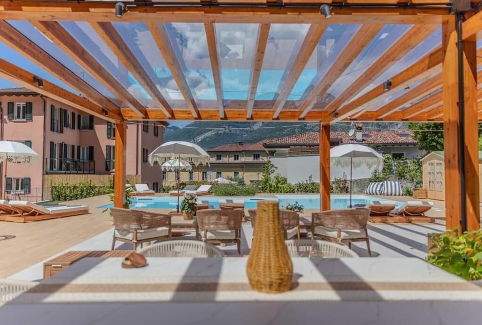 Seasonal outdoor pool, open 11:00 AM to 8:00 PM, pool umbrellas