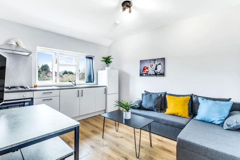 Stylish living space where cooking, dining, and relaxing all flow together.