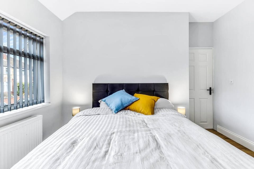 King-size bed dressed in crisp Egyptian cotton for a restful night.