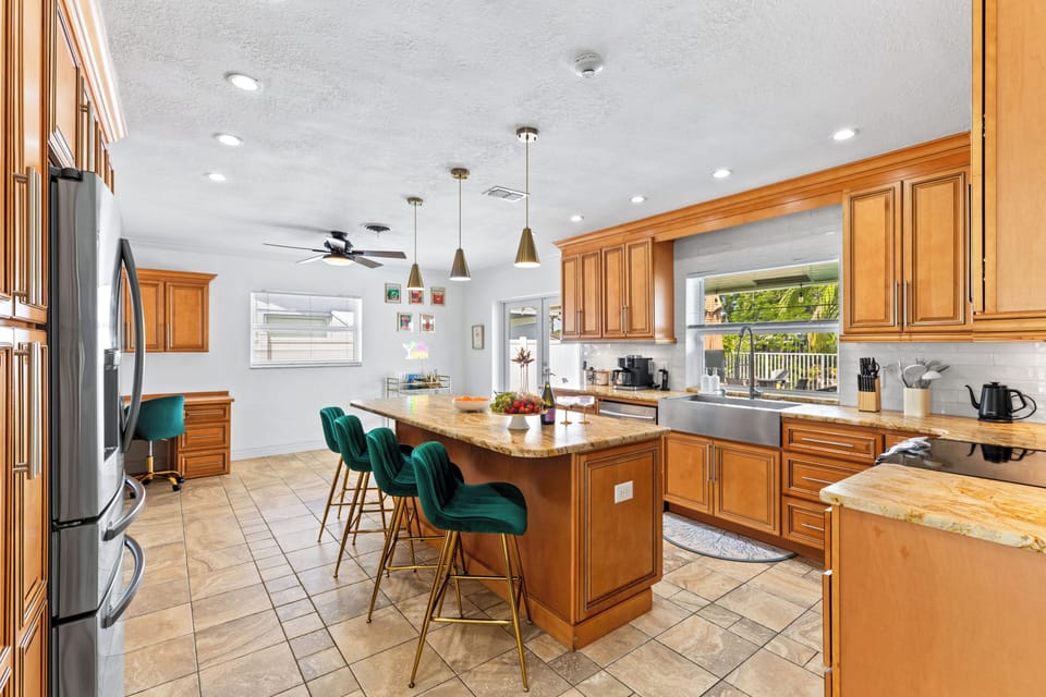 Gourmet kitchen with expansive wood cabinetry and a large island.