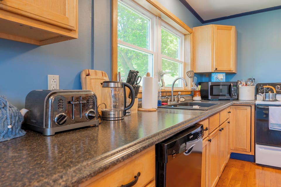 Kitchen counter with coffee and tea essentials.