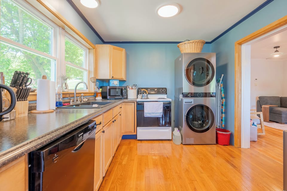 Convenient laundry area with extra kitchen storage.