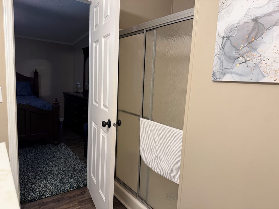 Private bathroom off the master with a walk-in shower and large garden tub.