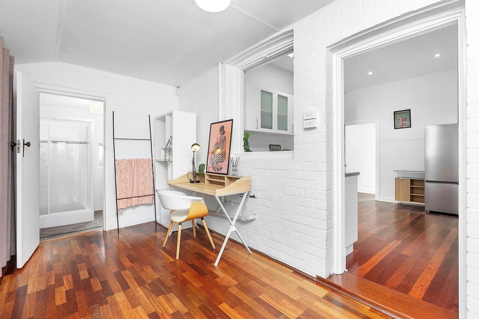 Work, relax, and refresh! Enjoy a convenient workspace, connected ensuite bathroom, and seamless flow to the kitchen from this versatile area.