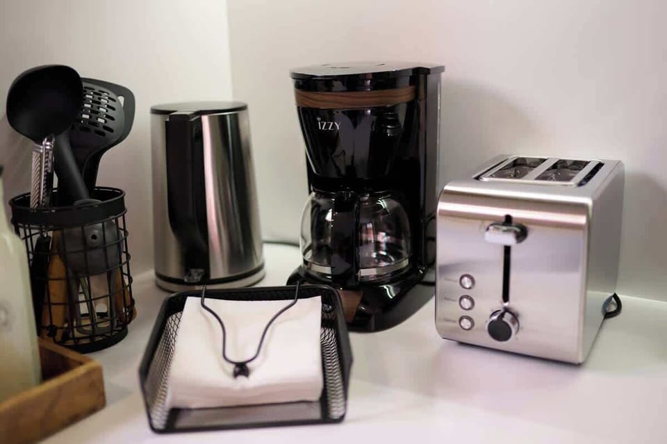 Convenient coffee/tea and breakfast station with coffee maker, kettle, toaster and all essentials for a perfect start to your day
