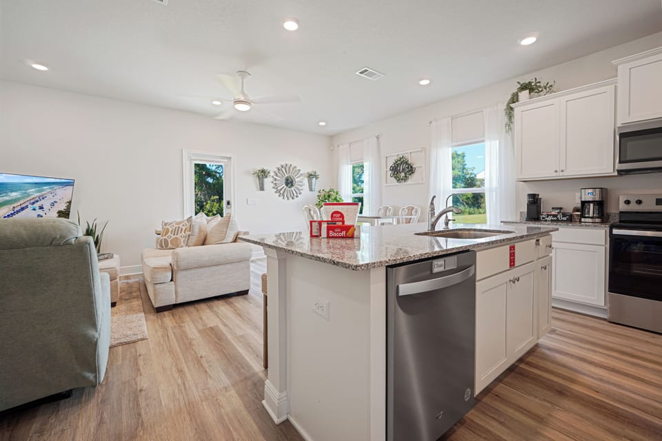 Your bright open-concept kitchen flows seamlessly into the cozy living space, perfect for preparing meals while staying connected with family.