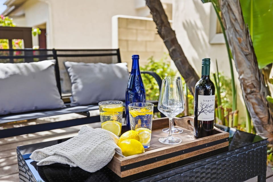 Enjoy the serene atmosphere of our secluded outdoor space, surrounded by mature trees and furnished for ultimate leisure.