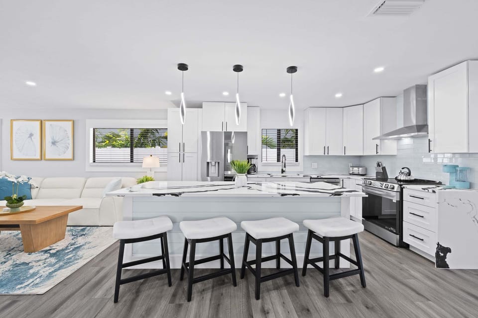 Modern chef's kitchen with oversized island seating—perfect for cooking, gathering, and entertaining.