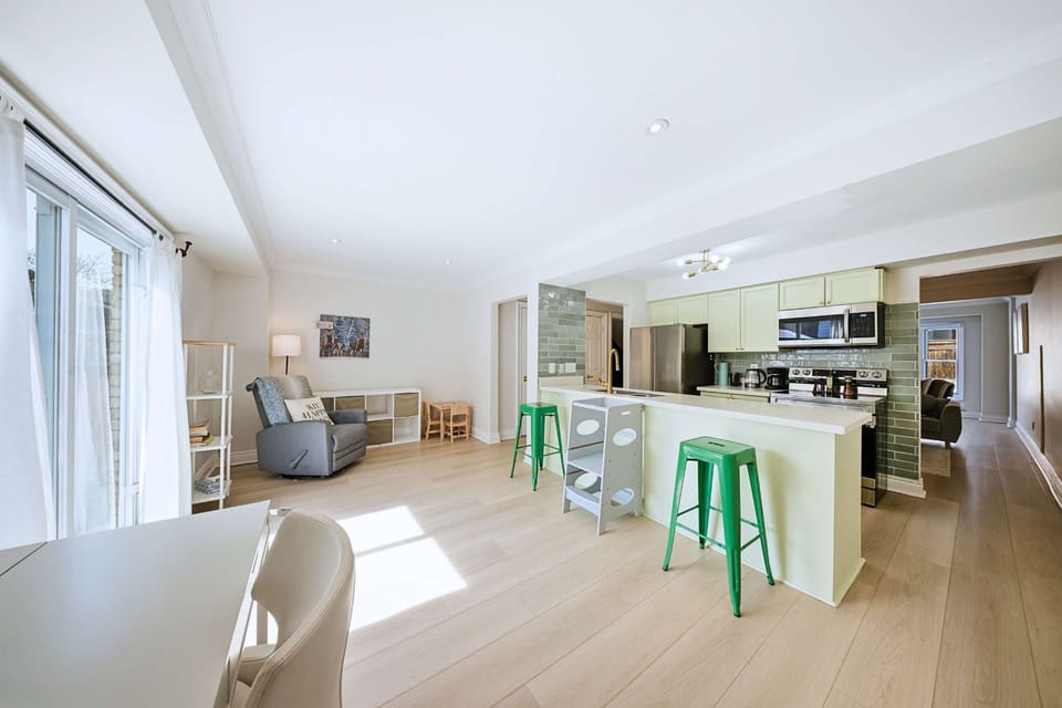 Open concept kitchen, living, and work space