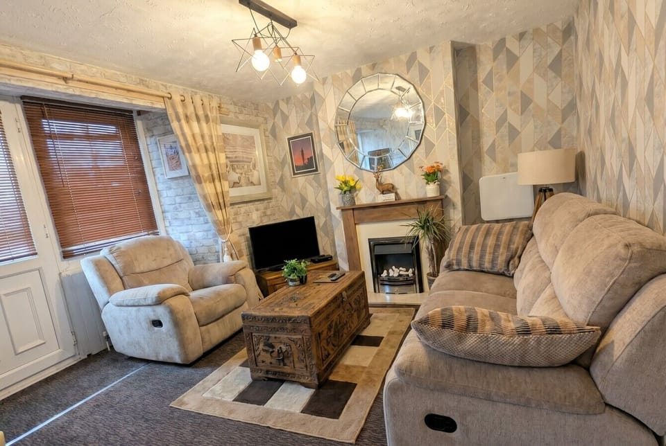 Sink into a recliner beside the fireplace for a proper night in.