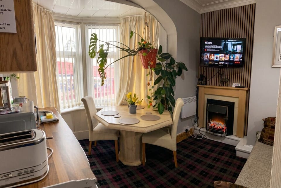 Relax with Netflix by the fire and dine beside the sunlit bay window.
