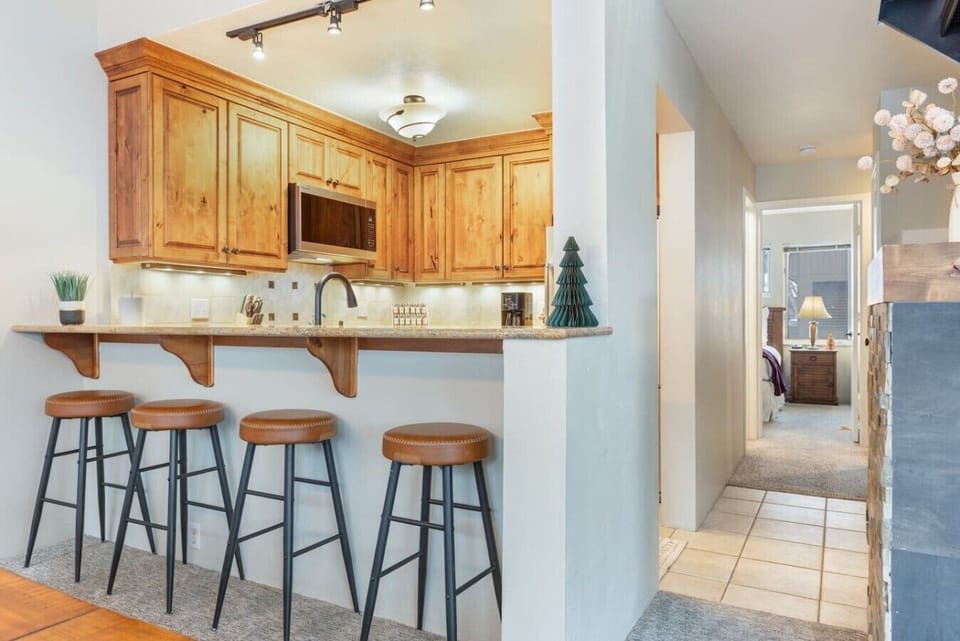 Fully equipped kitchen with bar seating
