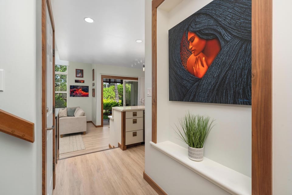 Warm wood accents and vibrant artwork welcome you into this thoughtfully designed space with modern comfort.