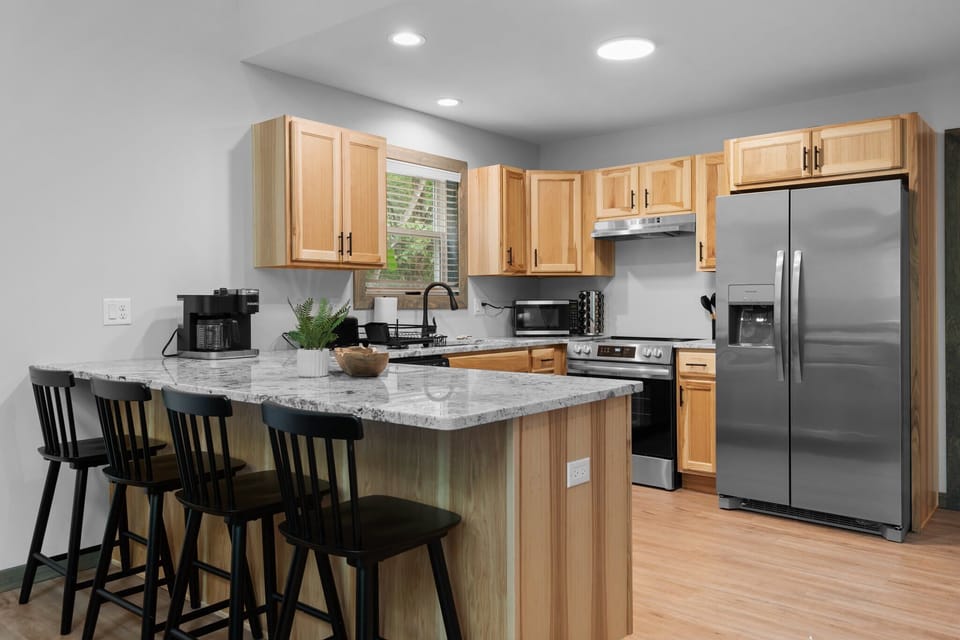 Designed for Convenience – A fully stocked kitchen with high-end appliances and generous cabinetry, perfect for any home chef.
