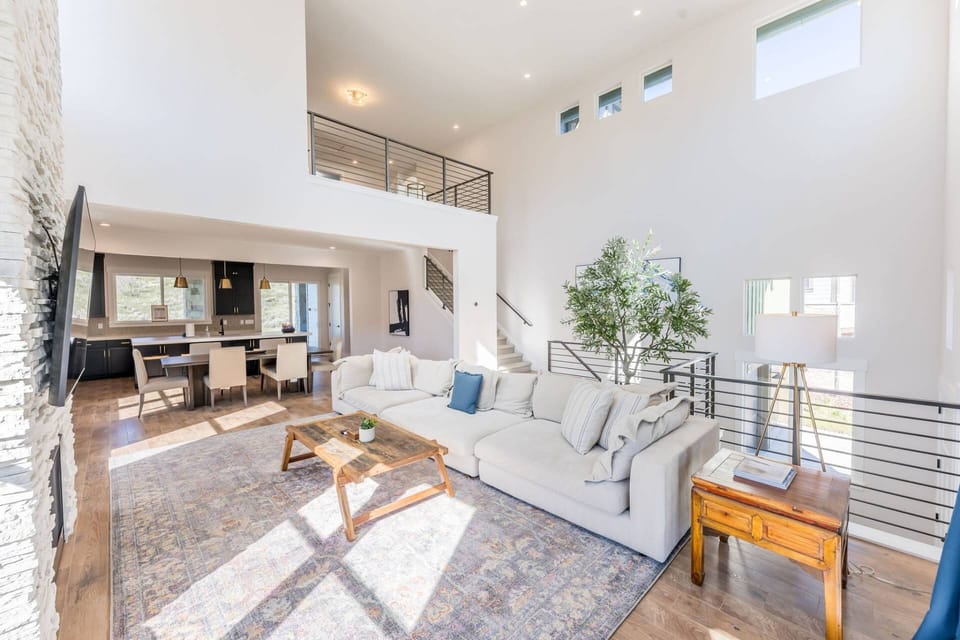 The Gathering House Great Room — 3 stories, open floor plan, loft above, kitchen flow, seats twelve