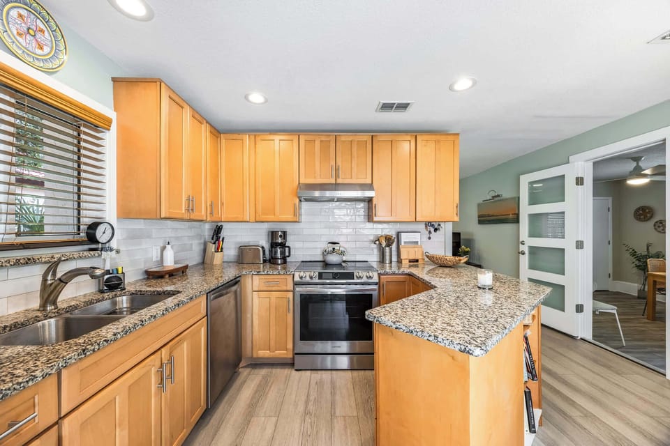 Modern kitchen with granite countertops and stainless steel appliances