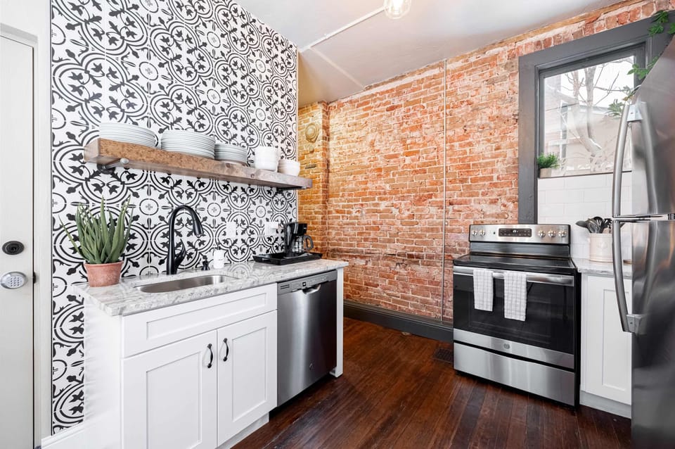 Kitchen with exposed brick on 1st floor