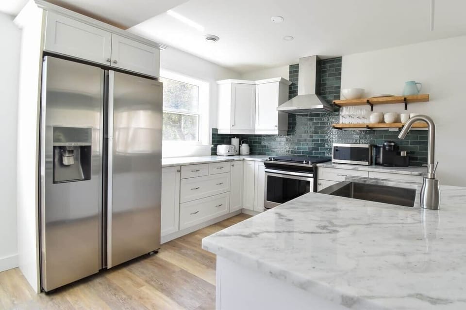 The gourmet kitchen with gas range, granite counters, and all the tools needed to cook incredible meals.