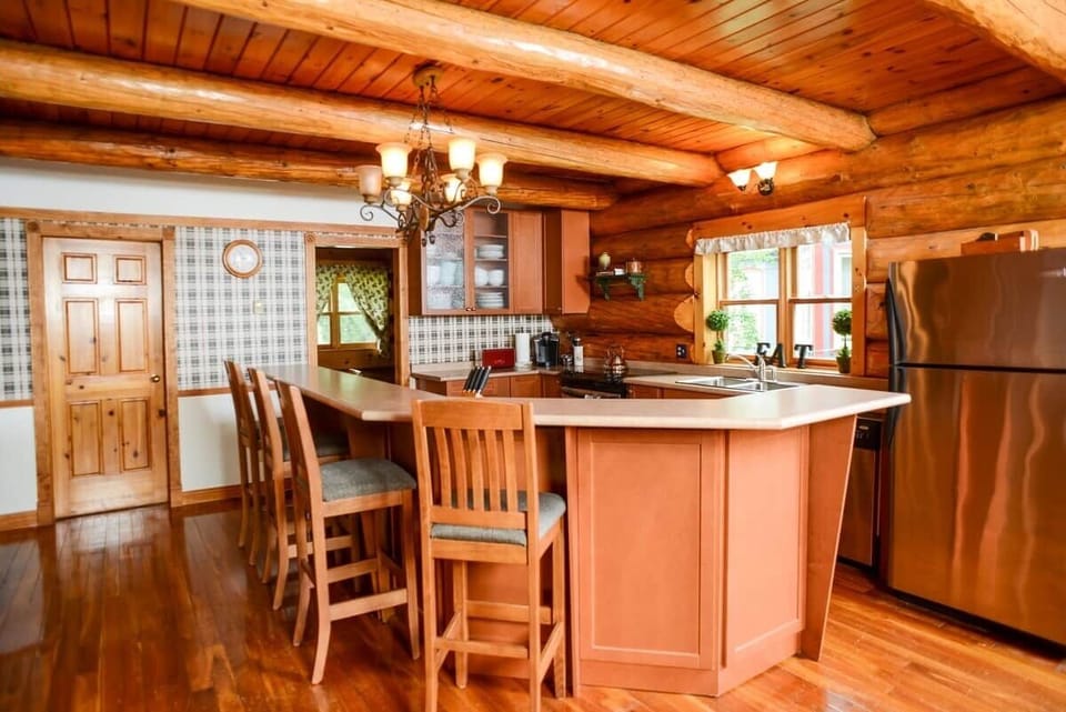 Chef's kitchen with fridge and freezer, dishwasher, 2 microwaves, 2 ovens, plates, glasses, measuring cups etc. 