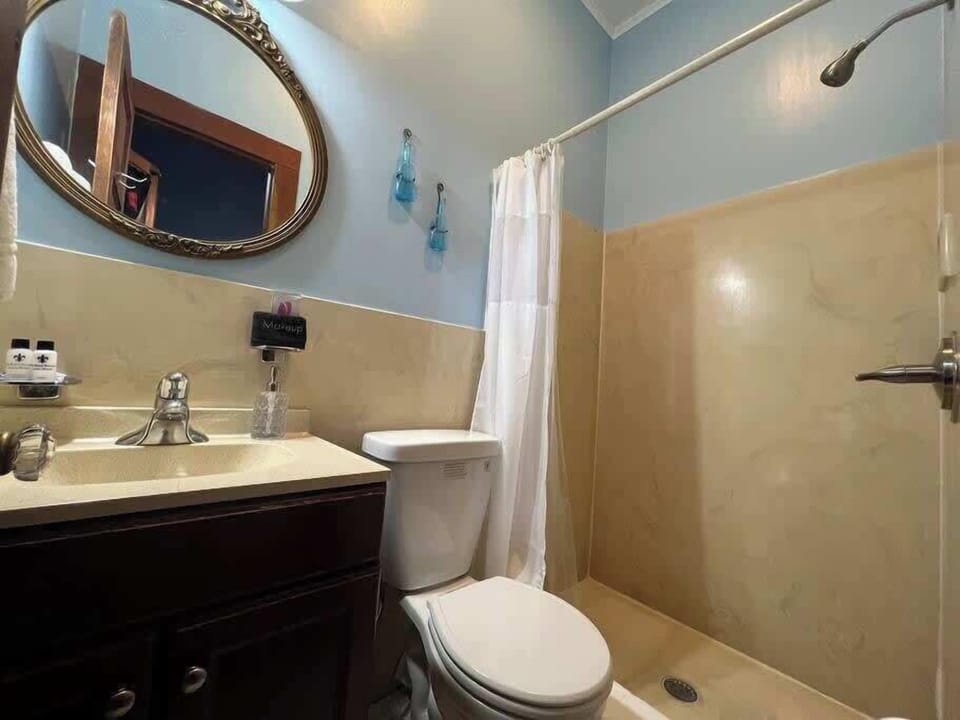 Full bathroom with vanity and tub/shower combo, offering everything you need for a comfortable stay.