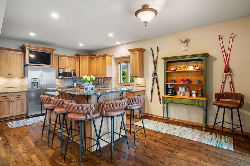 Spacious kitchen with all needed appliances and amenities for cooking and dining at home