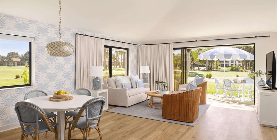 Bistro table and chairs on your private terrace — the spot for morning coffee before teeing off
