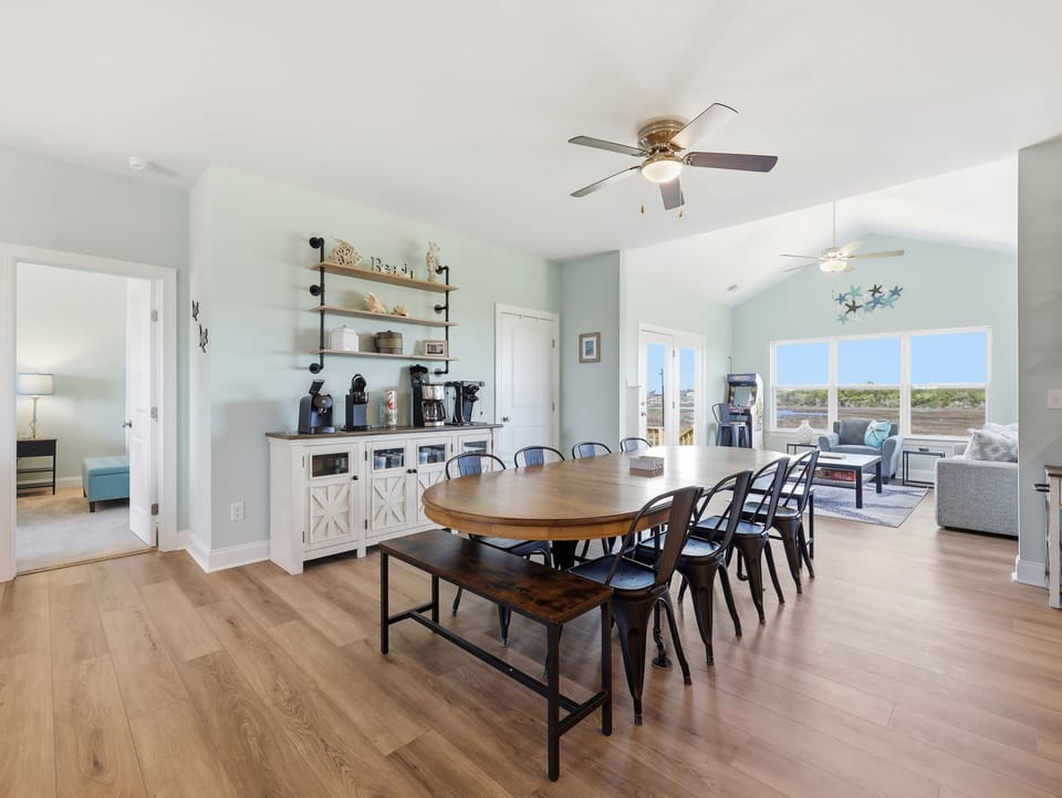 Coffee bar setup next to a spacious dining area with views throughout