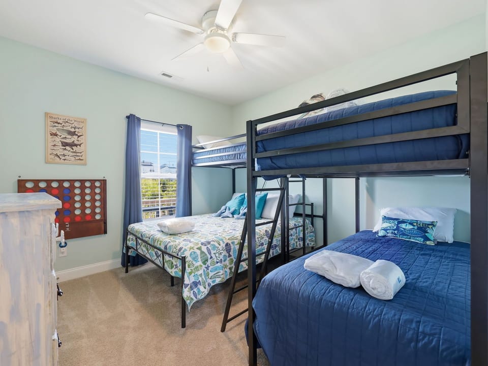 Spacious bunk room with queen, twin, and bunk beds—perfect for groups