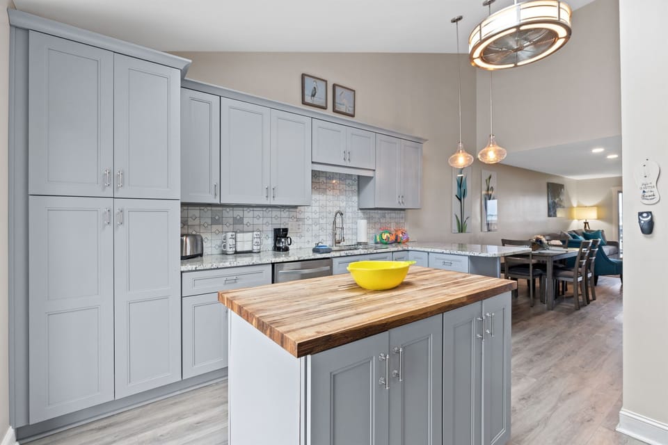Spacious kitchen with island prep space and room for everyone to help