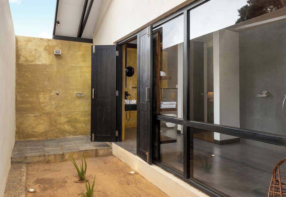 Jungle Dwelling | Bathroom | Shower, rainfall showerhead, free toiletries, hair dryer
