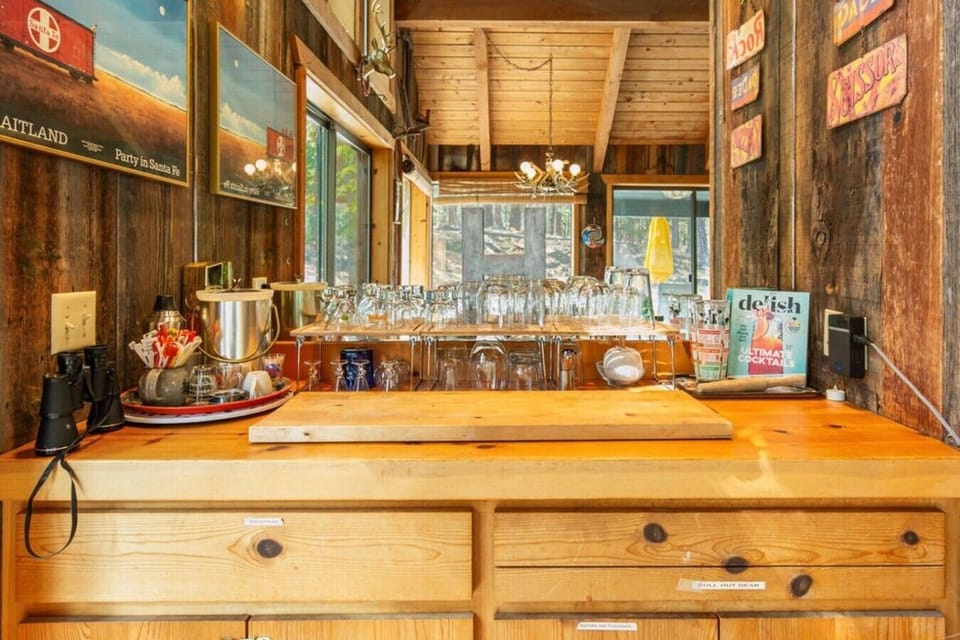 Bar area with glassware and space for drinks and snacks