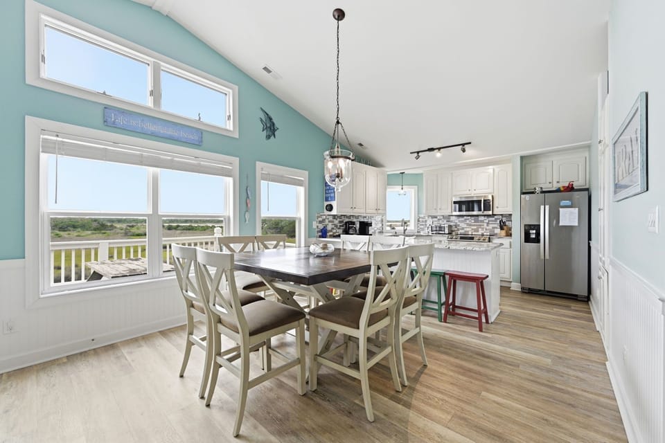 Share fresh seafood dinners and beach stories here at the dining table comfortably seating 8