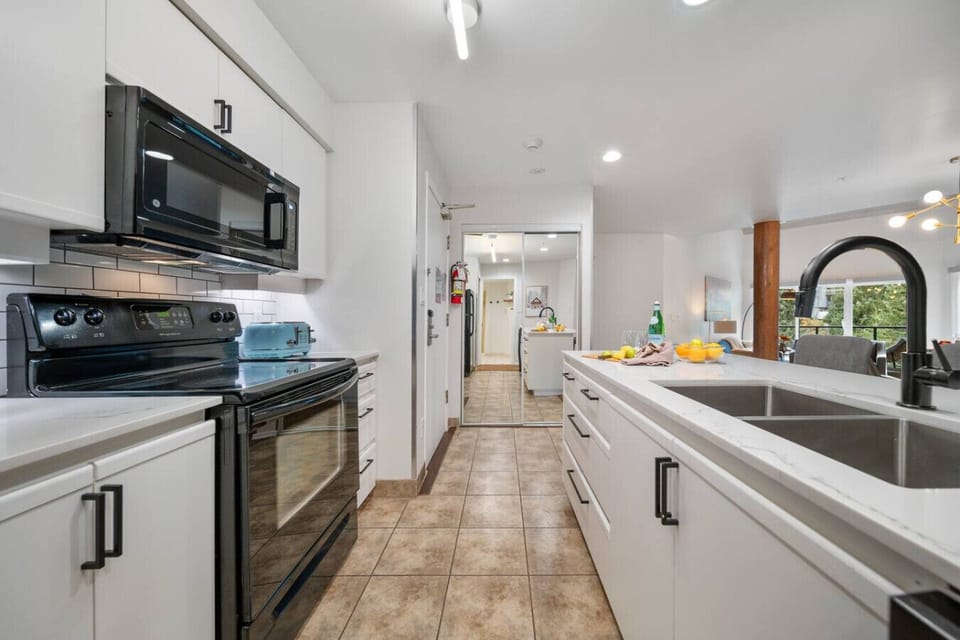 Modern spacious kitchen fully stocked with kitchen island