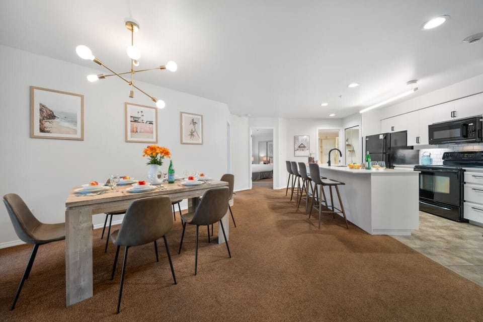 Dining area for six plus casual extra seating at the kitchen bar